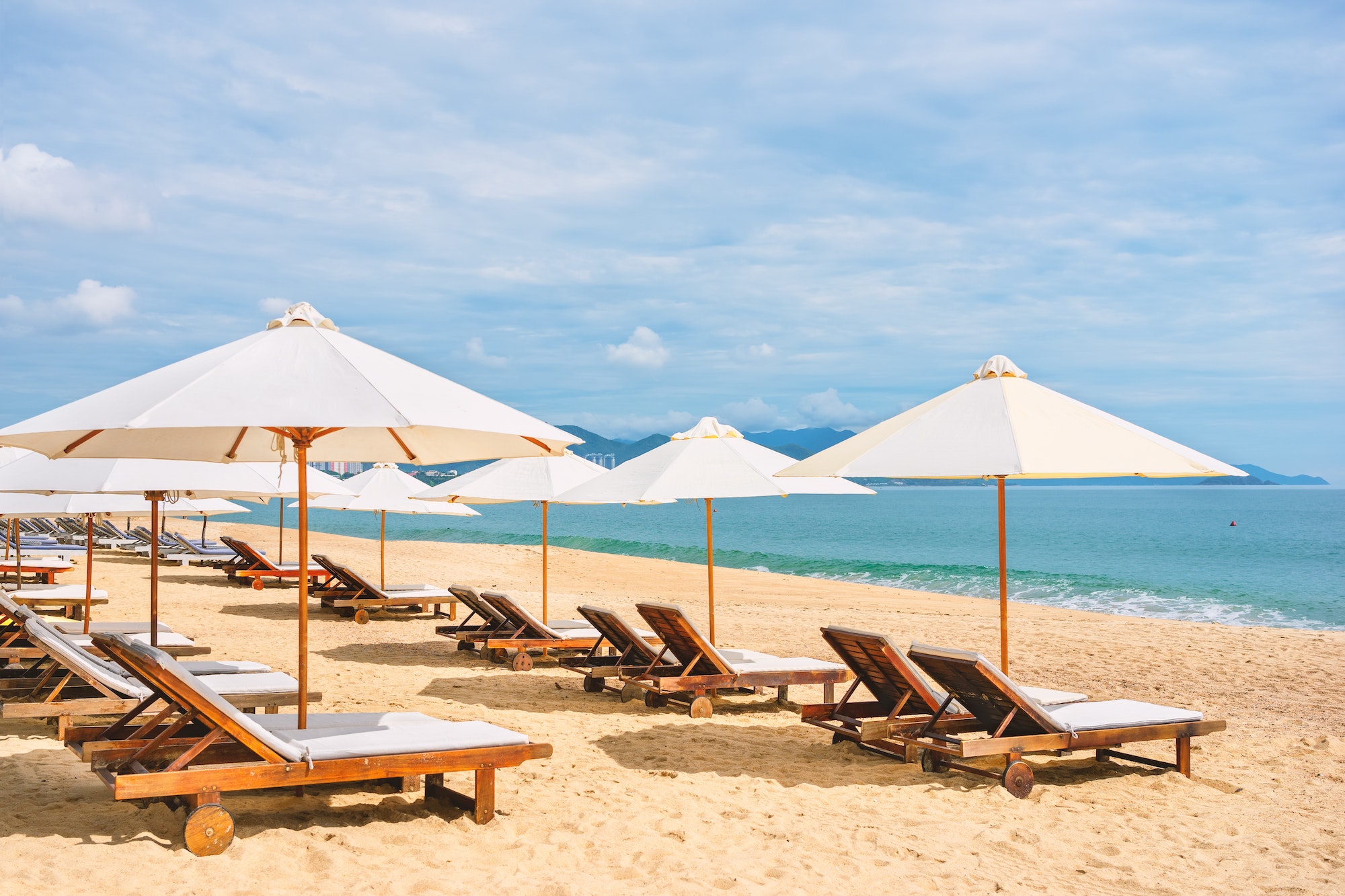 empty-sea-beach-with-sun-lounge-and-umbrella.jpg