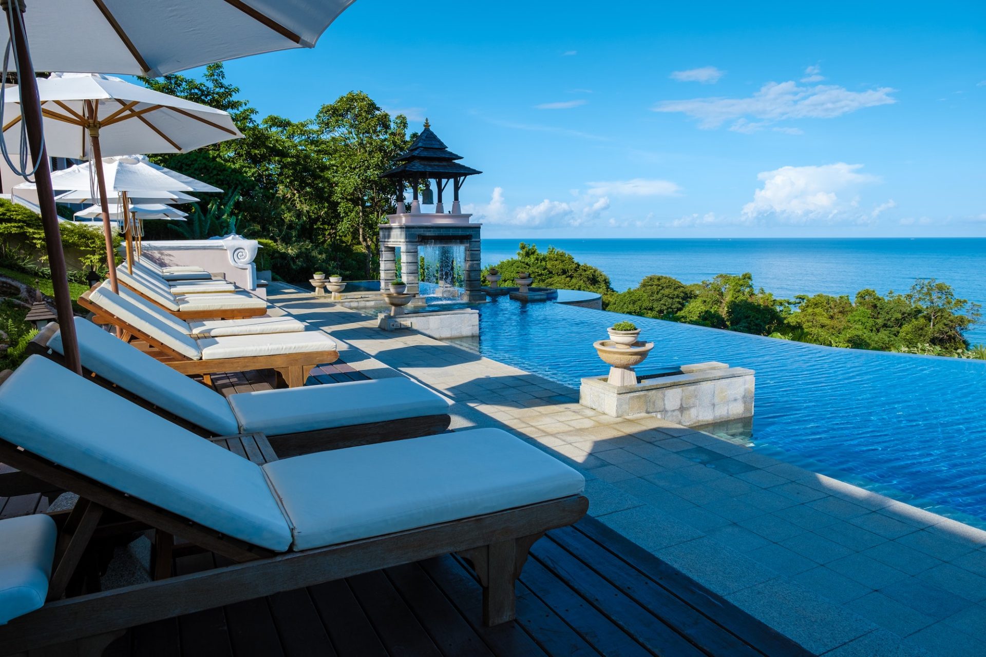 koh-lanta-thailand-luxury-beach-chairs-by-the-swimming-pool-of-an-luxury-hotel-in-thailand-e1689672953513.jpg